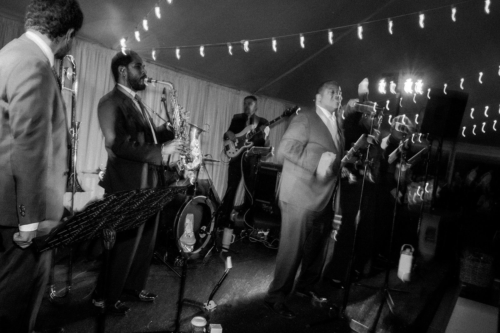 Blurry photo of band singing.