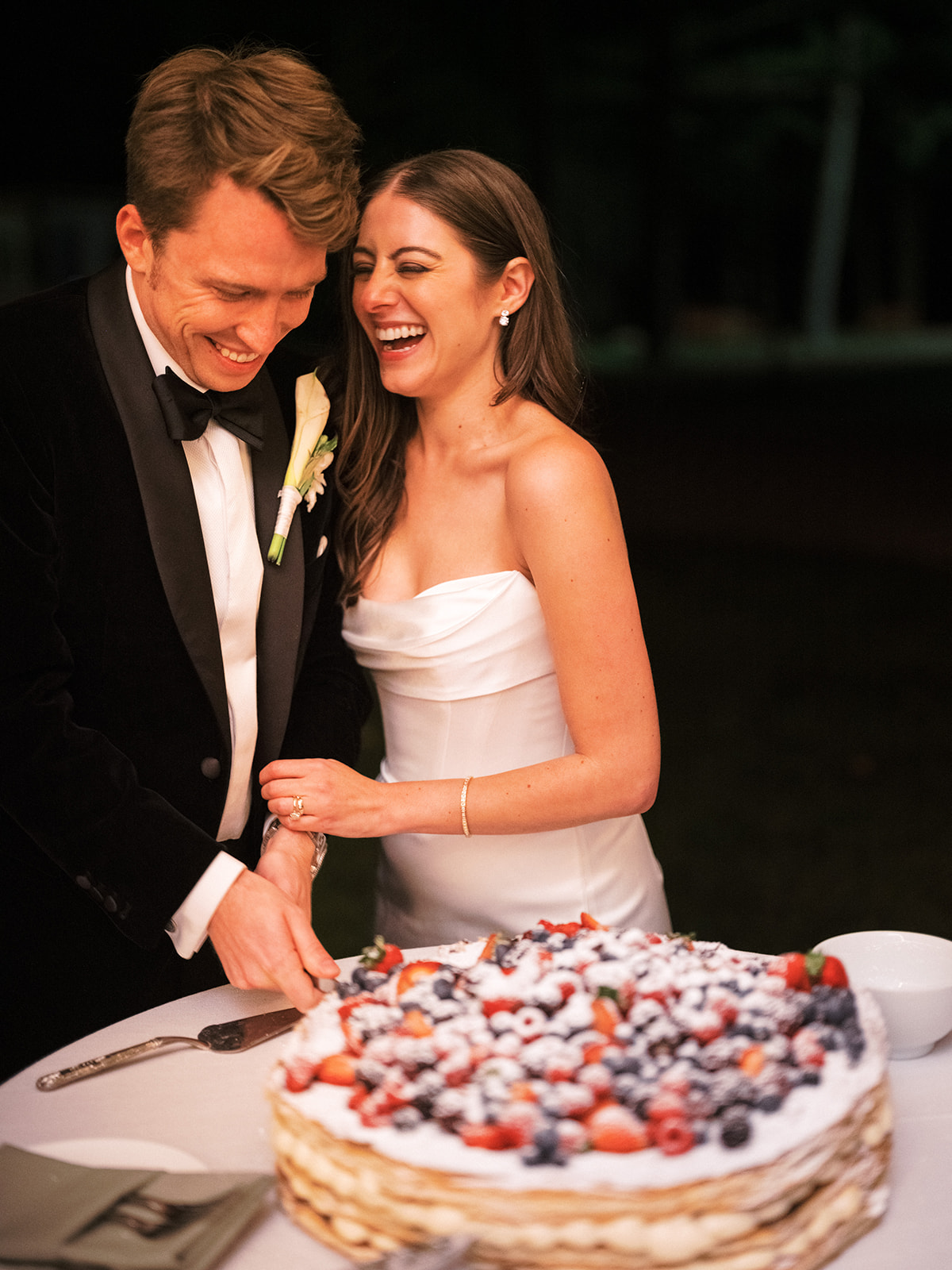 Bride and groom cut the cake.