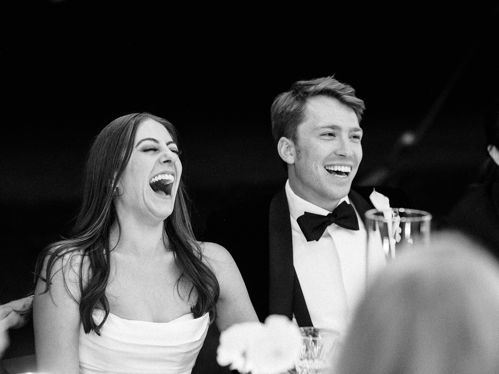 Bride and groom laugh during toasts at the Mount.