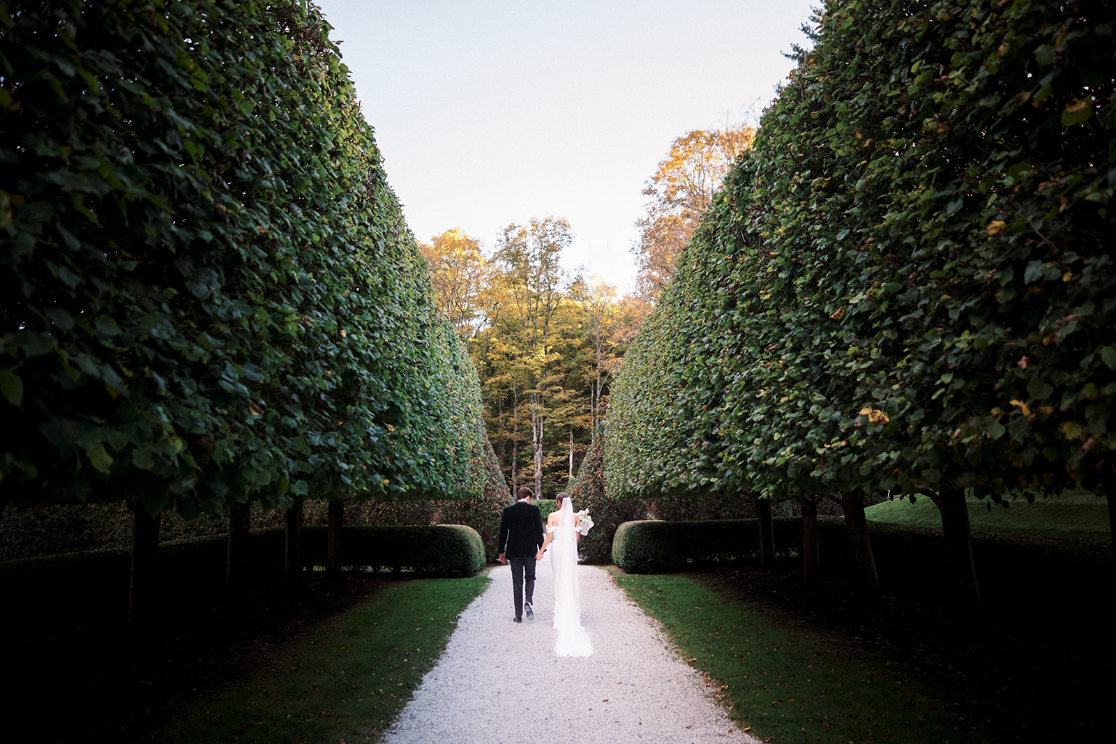 Bride and groom walking away from ceremony.