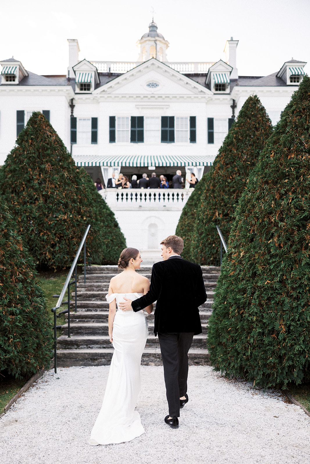 Bride and groom walking together to cocktail hour.
