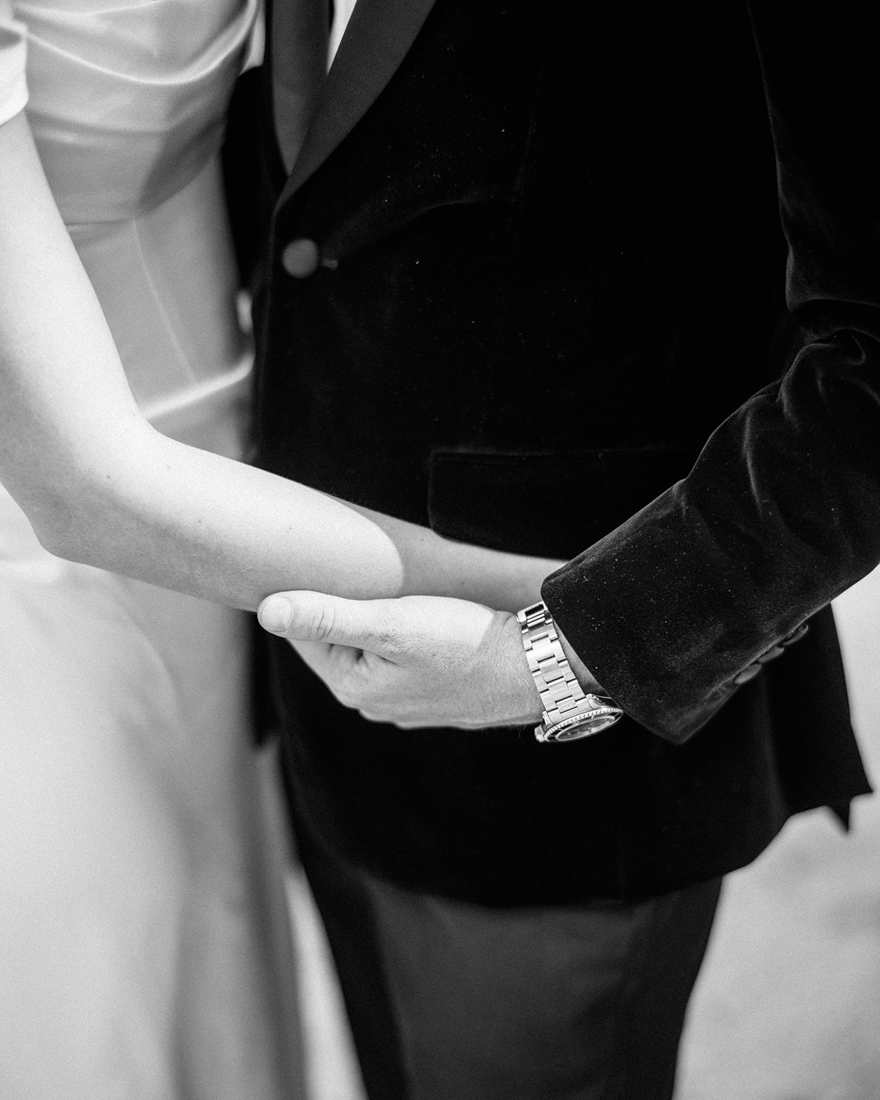 Close up of bride and groom embracing.
