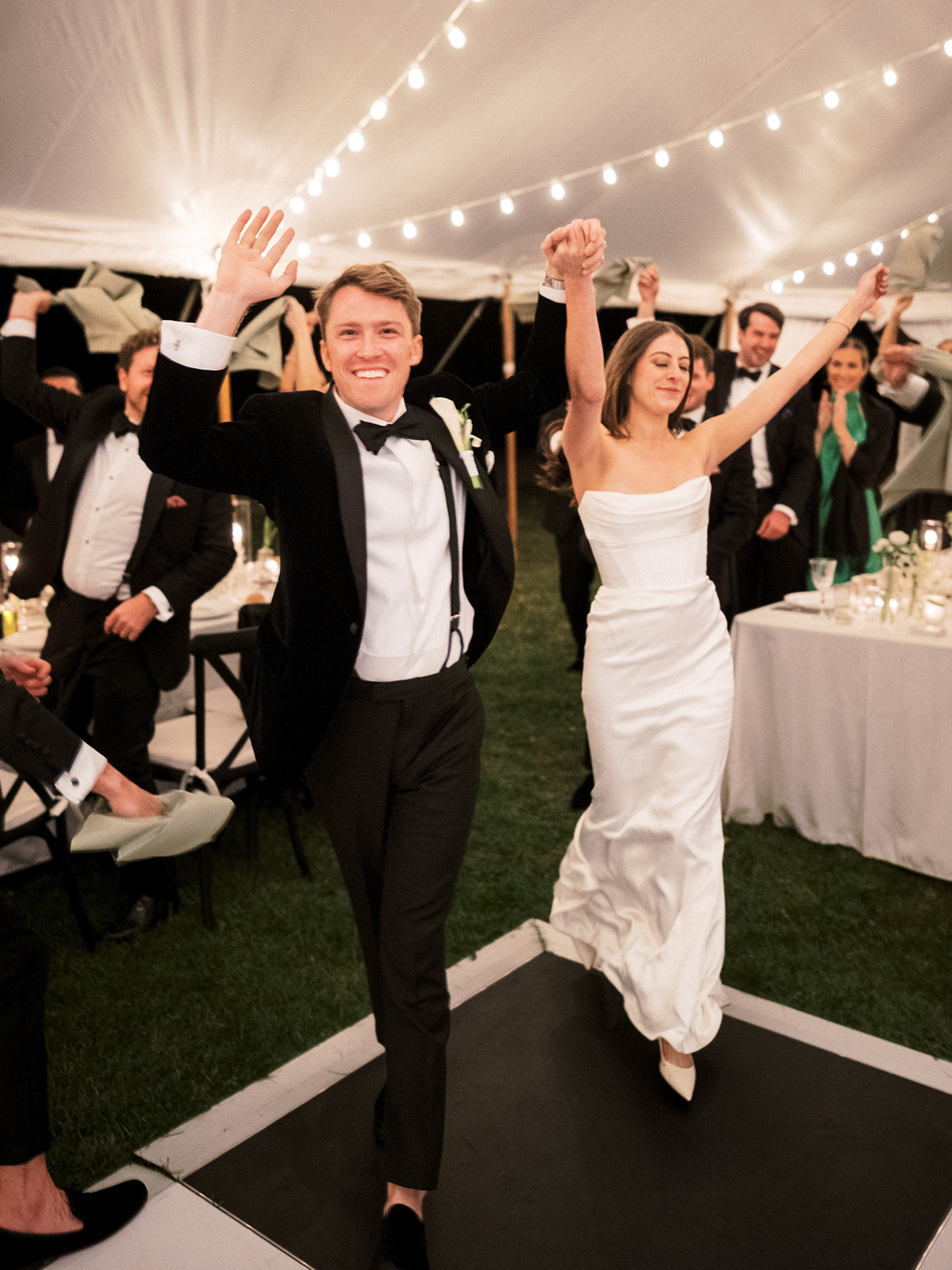 Couple enters their reception tent.