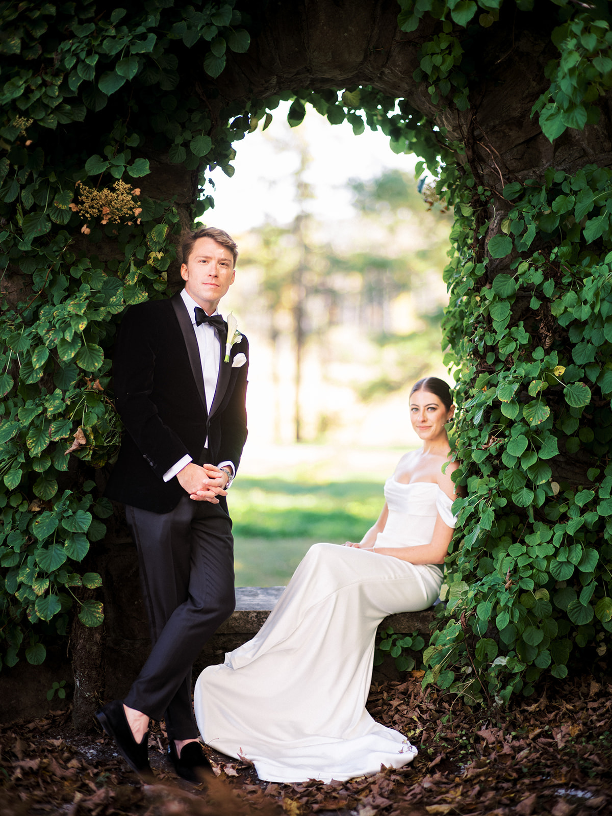 Elegant portrait of bride and groom in Garden area of the mount.