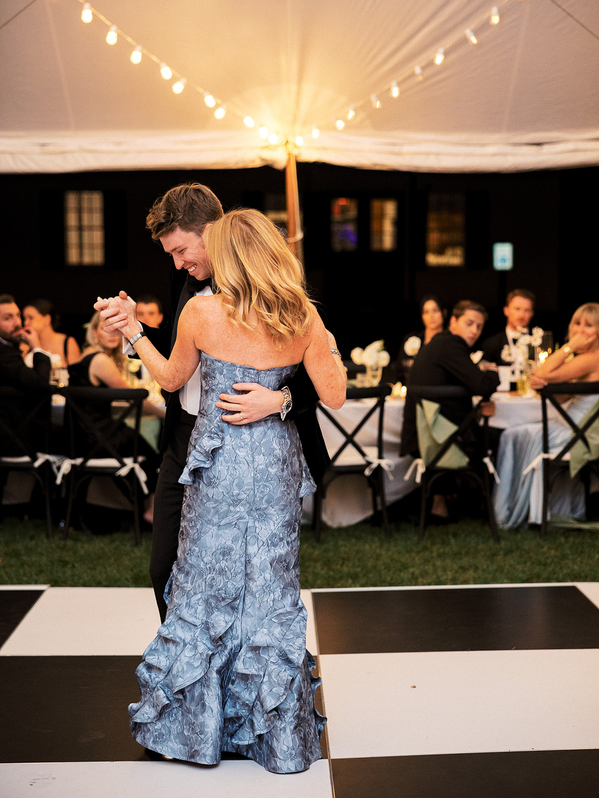 Groom dancing with his mother during the parent dances at the reception.