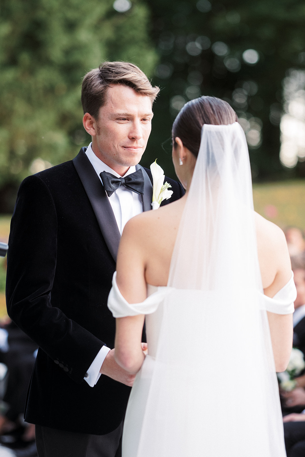 Groom looks at bride during ceremony.