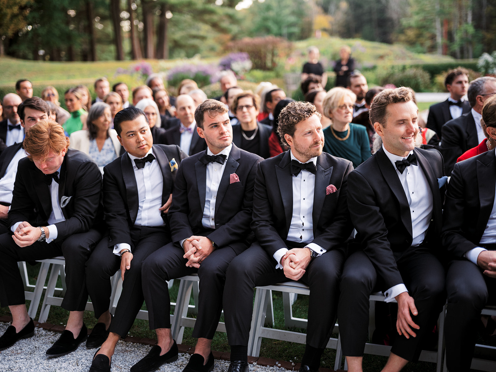 Groomsmen watch the ceremony.