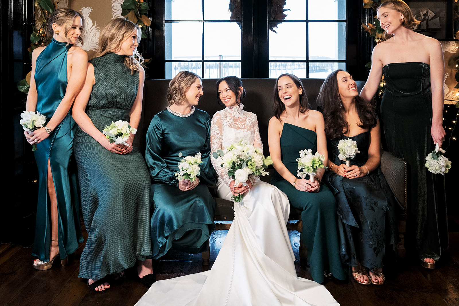 Bridal party standing together for formal group portraits at Baron's Cove.