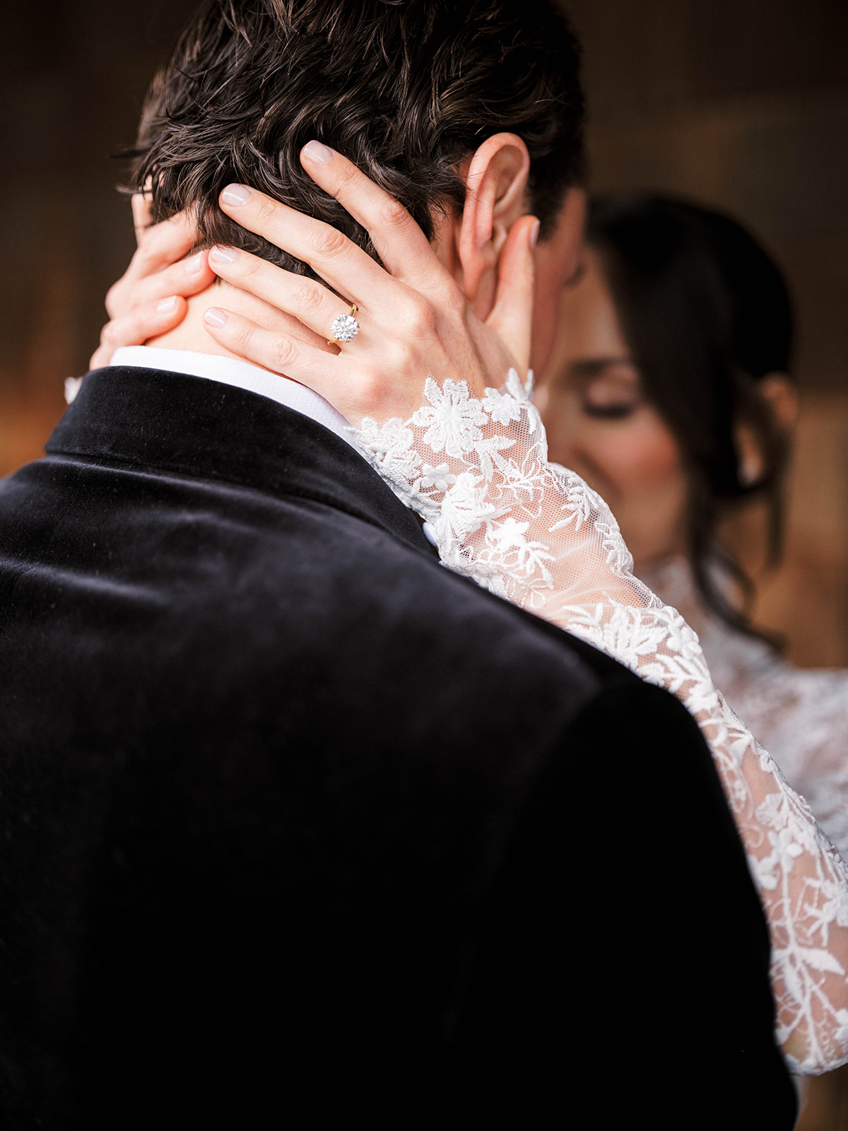 Bride and groom have foreheads together.