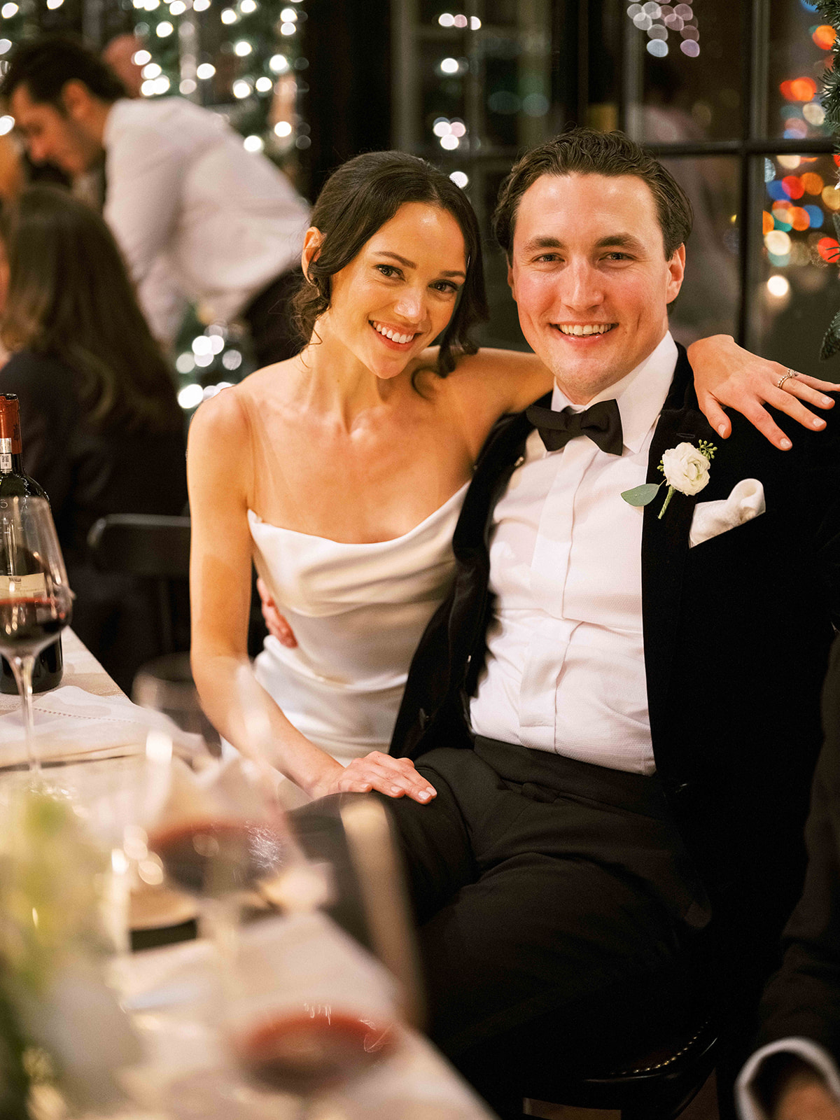 Bride and groom pose for camera.