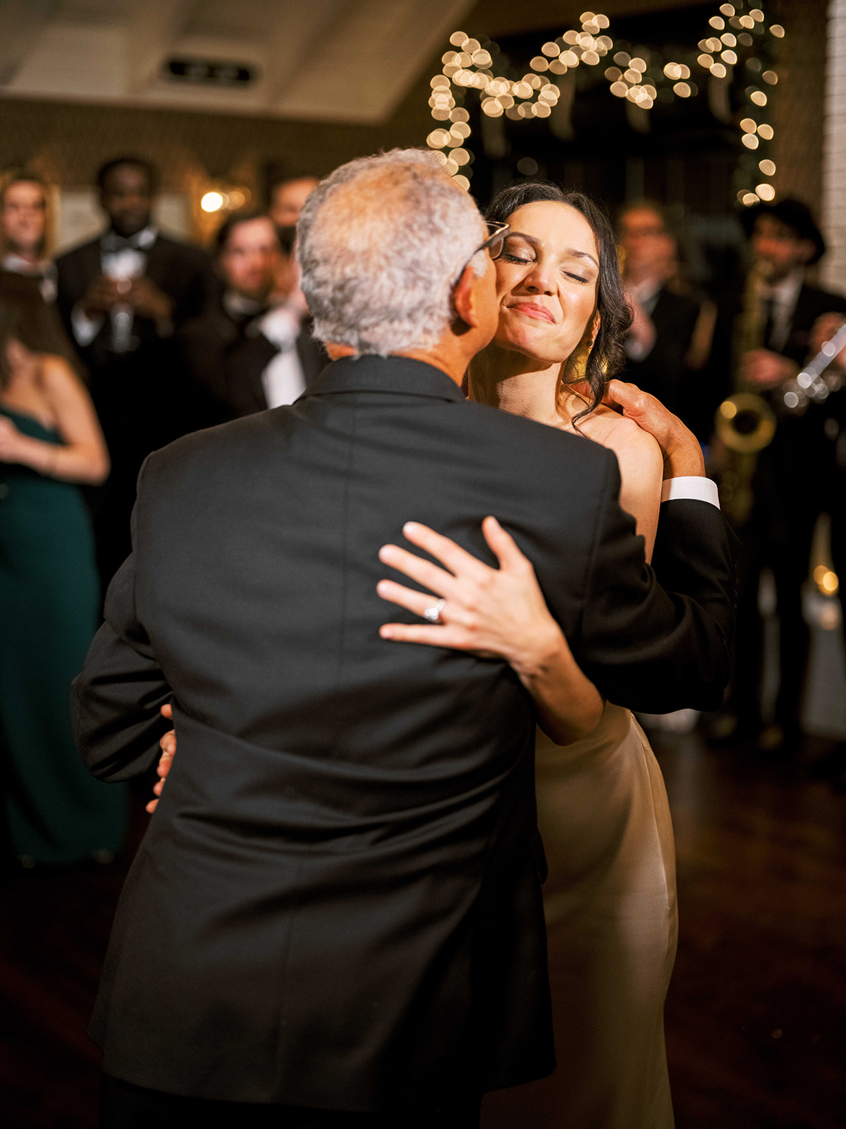 Bride hugging dad during the reception at Baron's Cove.