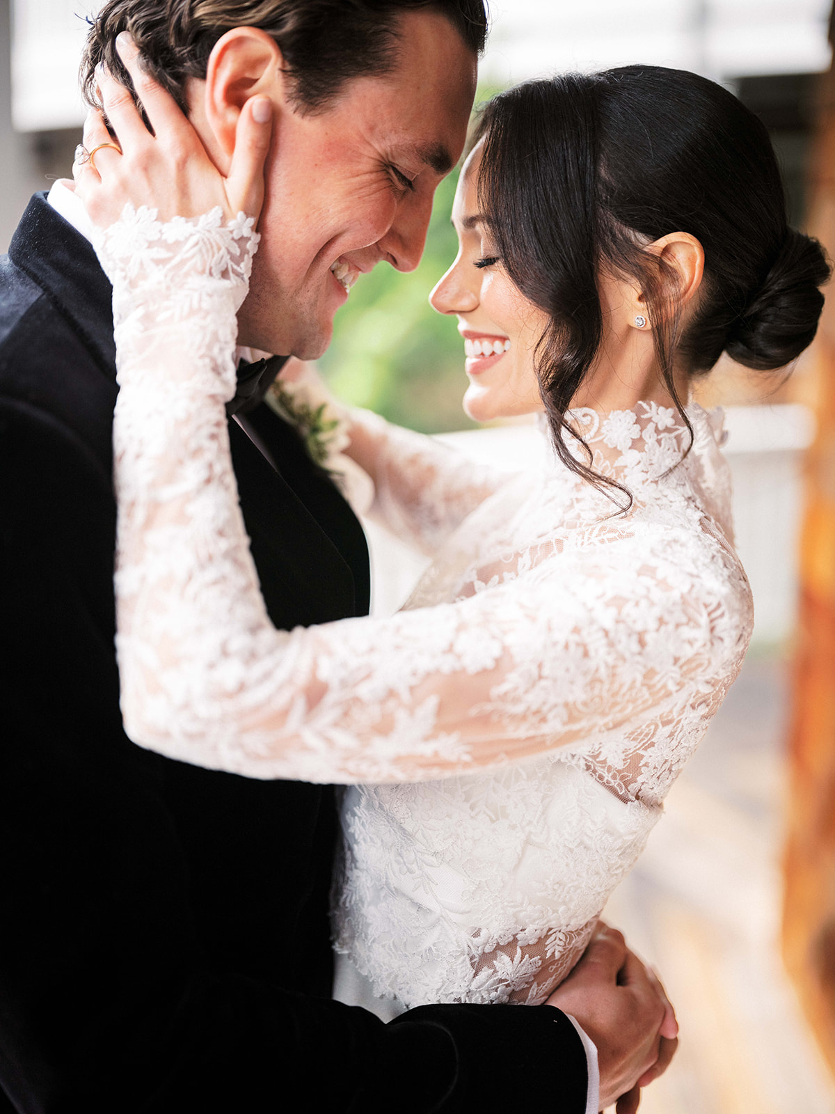Groom wiping away a tear after seeing the bride for the first time.