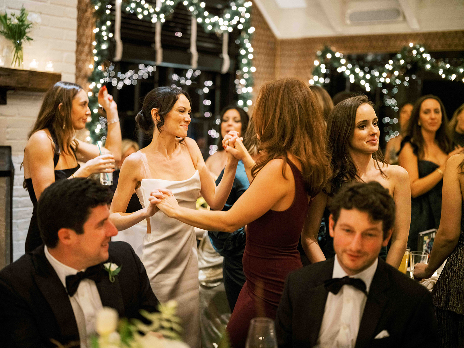 Packed dance floor full of energy and celebration during the reception.