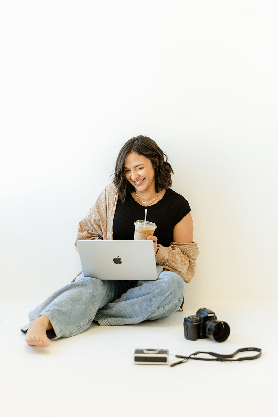Aimee Matias in a relaxed studio portrait