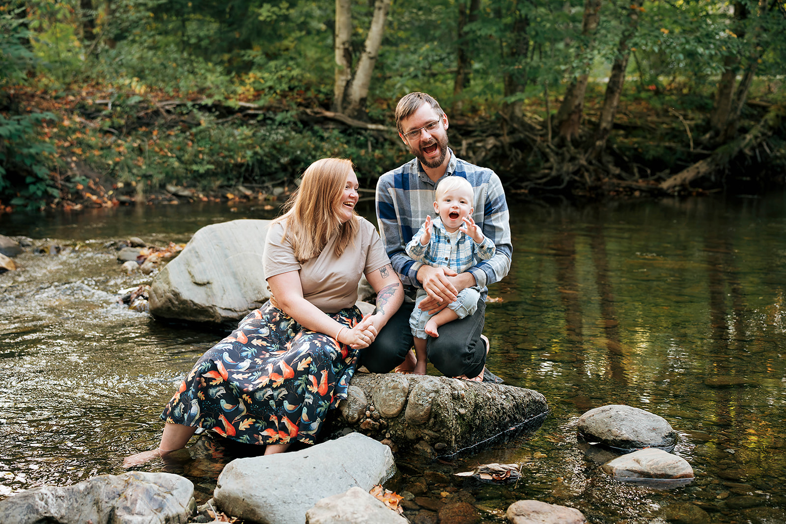Family by a mountain stream in Stowe, Vermont